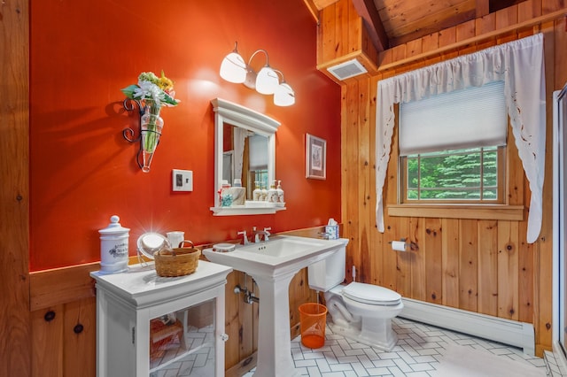 7 Reidy Way, Littleton, NH 03561 - bathroom featuring baseboard heating, brick patterned flooring, and wood walls