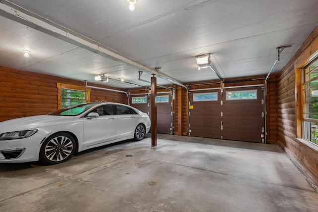 7 Reidy Way, Littleton, NH 03561 - garage featuring a garage door opener