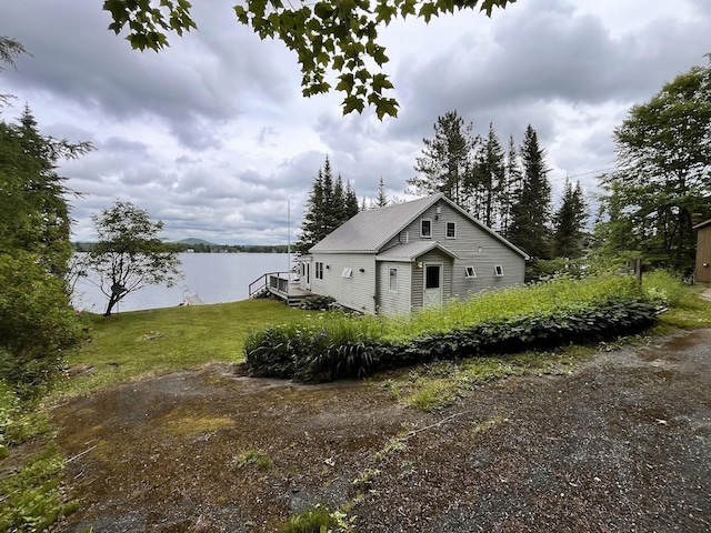 124 Spooner Rd, Pittsburg, NH 03592 - view of side of property featuring a water view and a yard