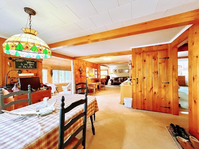 124 Spooner Rd, Pittsburg, NH 03592 - carpeted dining area with beamed ceiling and wooden walls