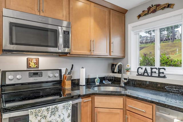 53 Evergreens Dr Unit 3, Laconia, NH 03246 - kitchen featuring appliances with stainless steel finishes, plenty of natural light, and dark stone countertops
