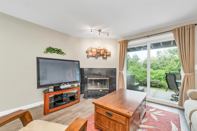 53 Evergreens Dr Unit 3, Laconia, NH 03246 - living room featuring wood finished floors and a tiled fireplace