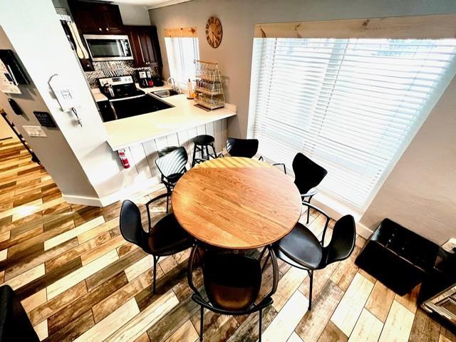 3 River Run Dr Unit A, Bartlett, NH 03812 - dining area with light wood-style floors