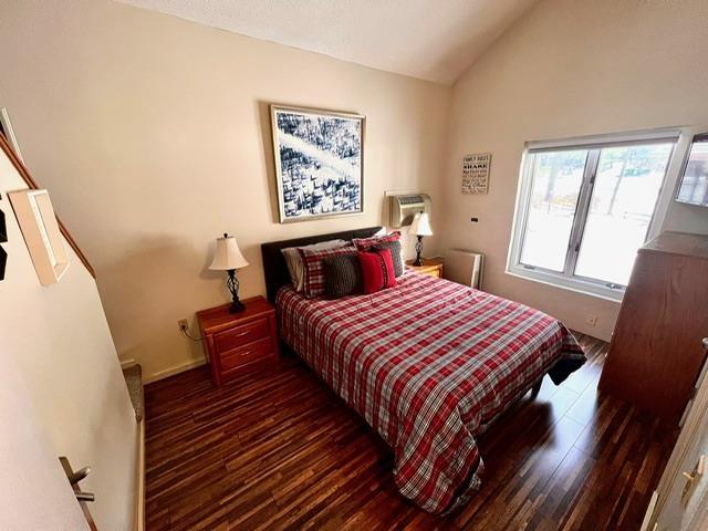 3 River Run Dr Unit A, Bartlett, NH 03812 - bedroom featuring vaulted ceiling and wood finished floors