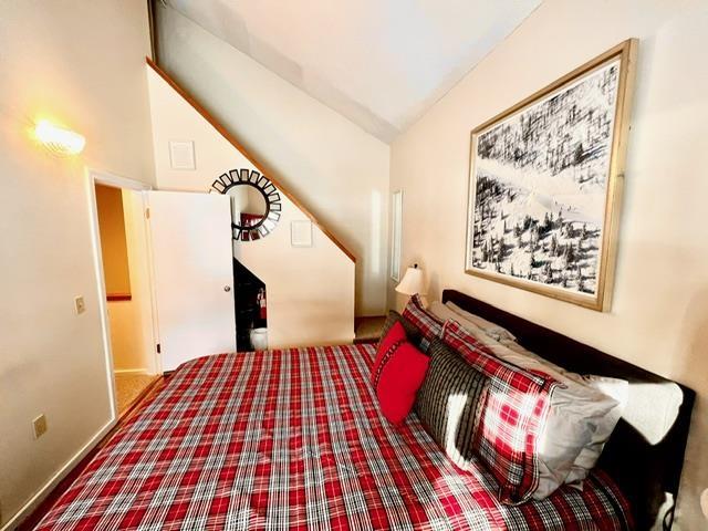 3 River Run Dr Unit A, Bartlett, NH 03812 - carpeted bedroom featuring vaulted ceiling