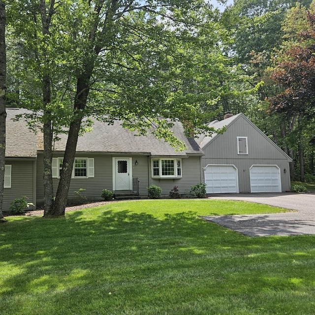 126 Flintlock Vlg Unit 3, Wells, ME 04090 - view of front of home with asphalt driveway, a front lawn, and roof with shingles