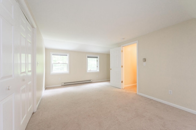 126 Flintlock Vlg Unit 3, Wells, ME 04090 - spare room featuring a baseboard radiator and light colored carpet