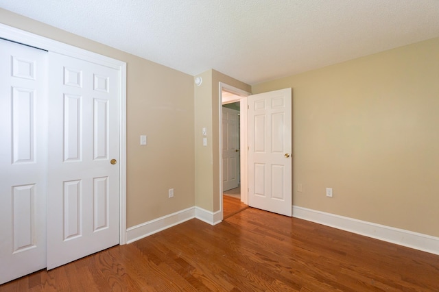 126 Flintlock Vlg Unit 3, Wells, ME 04090 - unfurnished bedroom featuring wood finished floors and baseboards