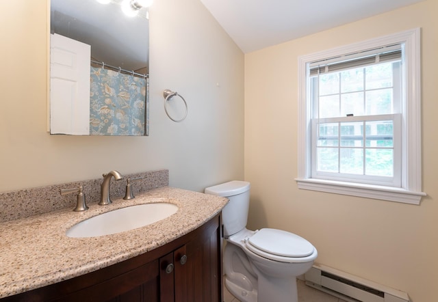 126 Flintlock Vlg Unit 3, Wells, ME 04090 - full bath featuring a baseboard radiator, plenty of natural light, vanity, and a shower with shower curtain