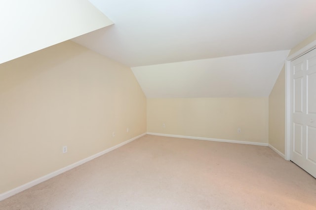 126 Flintlock Vlg Unit 3, Wells, ME 04090 - additional living space featuring vaulted ceiling and light colored carpet