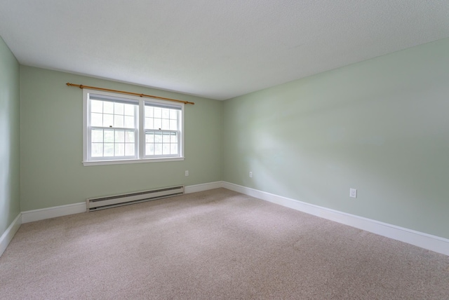 126 Flintlock Vlg Unit 3, Wells, ME 04090 - spare room with a baseboard heating unit and light carpet