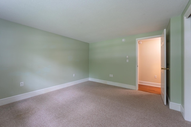 126 Flintlock Vlg Unit 3, Wells, ME 04090 - carpeted empty room featuring a textured ceiling