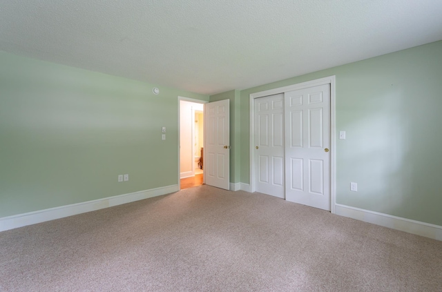 126 Flintlock Vlg Unit 3, Wells, ME 04090 - unfurnished bedroom featuring carpet and a closet
