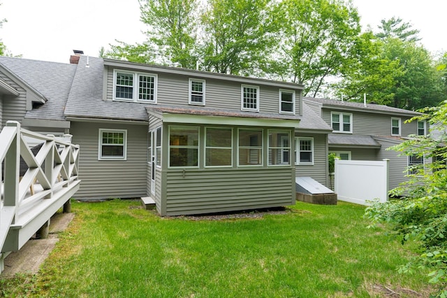 126 Flintlock Vlg Unit 3, Wells, ME 04090 - back of house featuring a shingled roof and a chimney