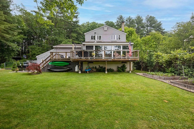 12 Water Rd, Goffstown, NH 03045 - back of property with a wooden deck, a garden, and stairs