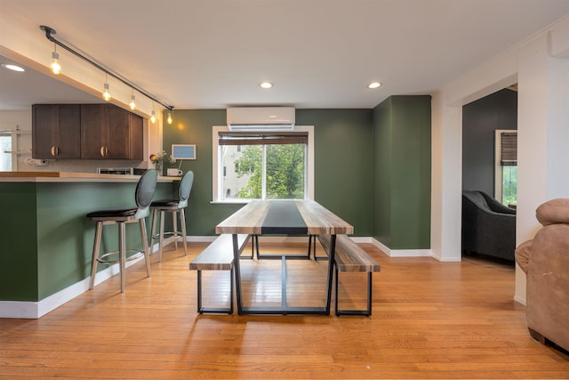 12 Water Rd, Goffstown, NH 03045 - dining room with a wall mounted AC, light wood-style flooring, and recessed lighting