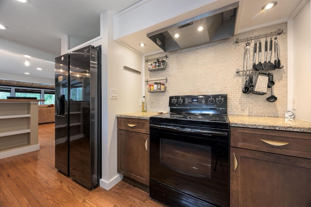 12 Water Rd, Goffstown, NH 03045 - kitchen with black electric range, refrigerator with ice dispenser, range hood, tasteful backsplash, and recessed lighting