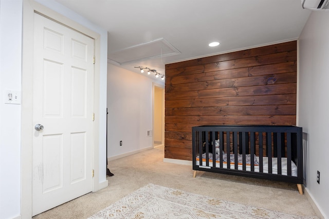 12 Water Rd, Goffstown, NH 03045 - unfurnished bedroom featuring attic access, carpet flooring, a wall mounted air conditioner, wood walls, and recessed lighting