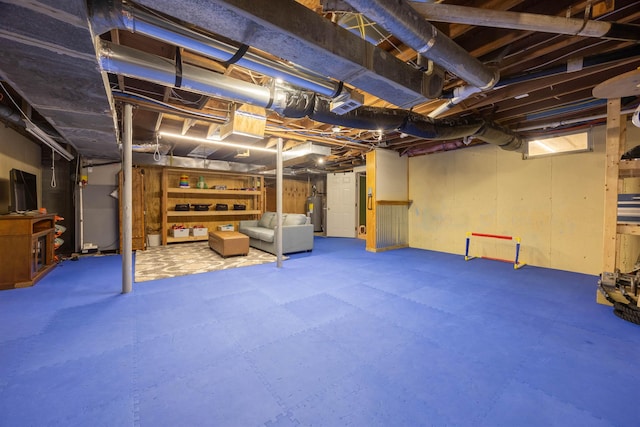 12 Water Rd, Goffstown, NH 03045 - unfinished below grade area featuring electric water heater