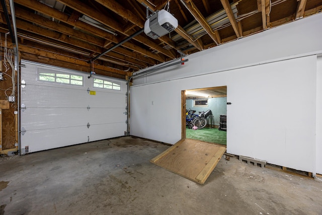 12 Water Rd, Goffstown, NH 03045 - garage featuring a garage door opener