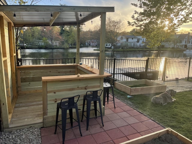 12 Water Rd, Goffstown, NH 03045 - patio terrace at dusk featuring a water view and a garden