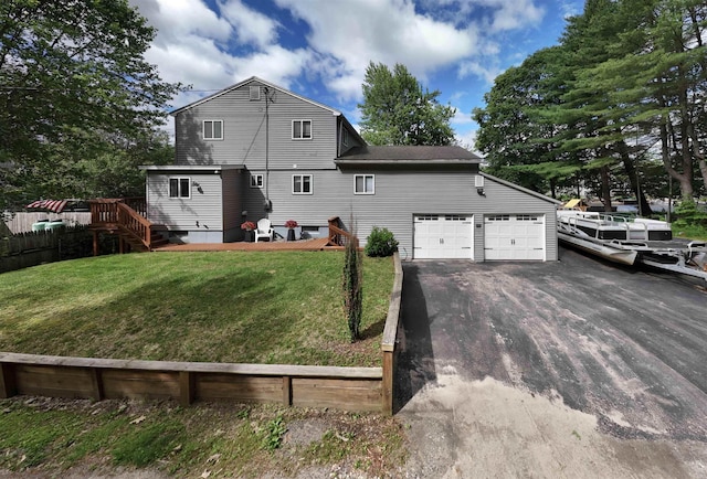 12 Water Rd, Goffstown, NH 03045 - rear view of property with an attached garage and driveway