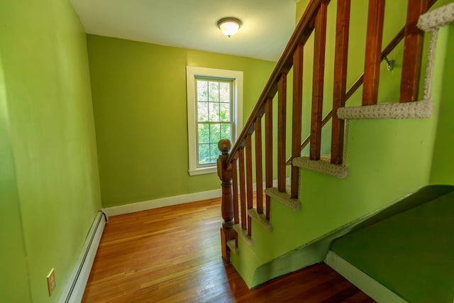 123 S Lincoln St, Keene, NH 03431 - stairs with hardwood / wood-style flooring and a baseboard radiator
