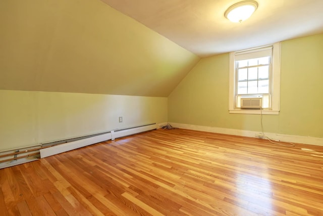123 S Lincoln St, Keene, NH 03431 - additional living space featuring baseboard heating, light wood-style flooring, lofted ceiling, and cooling unit