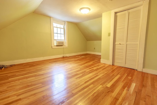 123 S Lincoln St, Keene, NH 03431 - additional living space featuring light wood finished floors, lofted ceiling, and cooling unit