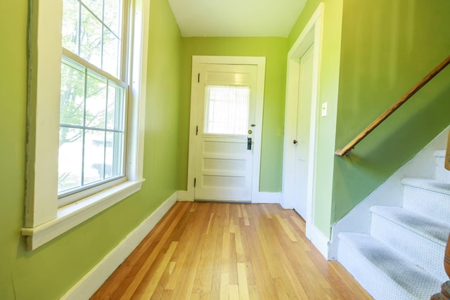 123 S Lincoln St, Keene, NH 03431 - doorway to outside featuring light wood finished floors, stairs, and plenty of natural light