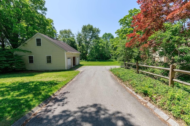 123 S Lincoln St, Keene, NH 03431 - view of side of home with asphalt driveway and an attached garage
