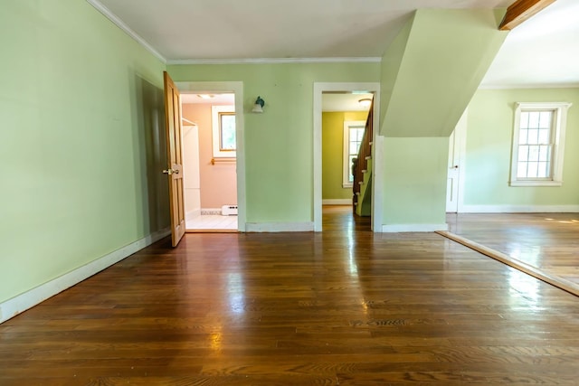 123 S Lincoln St, Keene, NH 03431 - unfurnished living room featuring wood finished floors, ornamental molding, and baseboard heating