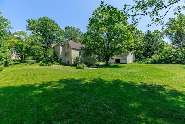 123 S Lincoln St, Keene, NH 03431 - view of green lawn featuring an outbuilding and an attached garage