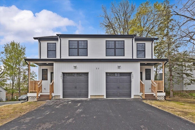23 Ferris St Unit 102, Saint Albans City, VT 05478 - view of front of home with asphalt driveway and an attached garage