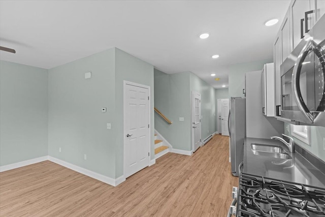 23 Ferris St Unit 102, Saint Albans City, VT 05478 - kitchen featuring stainless steel appliances, light wood-type flooring, recessed lighting, and white cabinetry