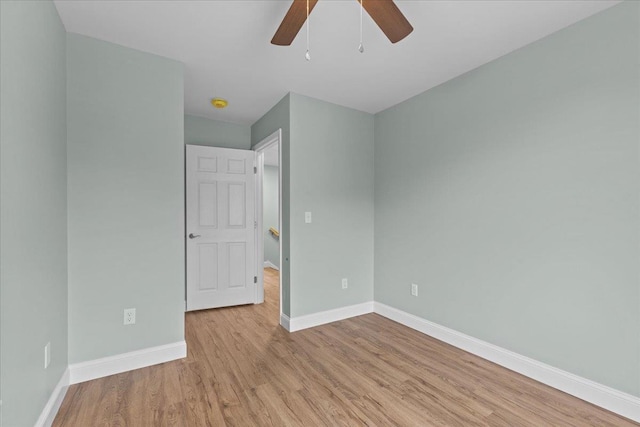 23 Ferris St Unit 102, Saint Albans City, VT 05478 - unfurnished bedroom featuring wood finished floors and ceiling fan