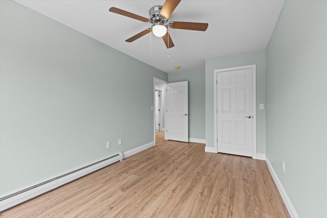 23 Ferris St Unit 102, Saint Albans City, VT 05478 - unfurnished bedroom featuring a baseboard radiator, light wood-type flooring, and ceiling fan
