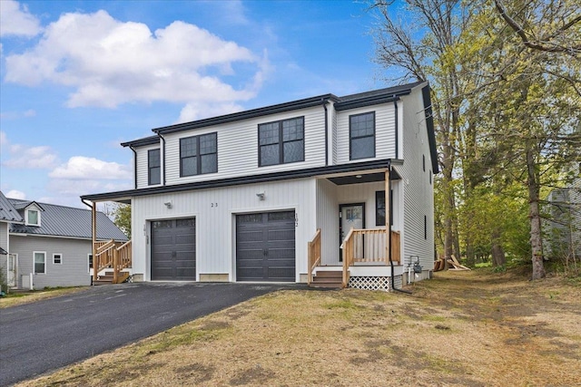 23 Ferris St Unit 102, Saint Albans City, VT 05478 - view of front of property with driveway and an attached garage
