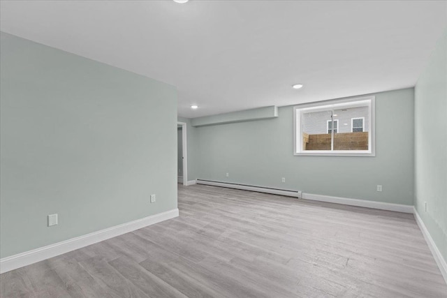 23 Ferris St Unit 102, Saint Albans City, VT 05478 - unfurnished room featuring a baseboard radiator, wood finished floors, and recessed lighting