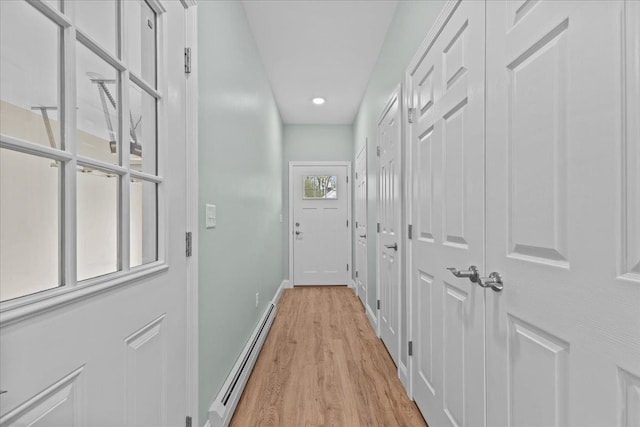 23 Ferris St Unit 102, Saint Albans City, VT 05478 - corridor with baseboard heating, light wood-style floors, and recessed lighting