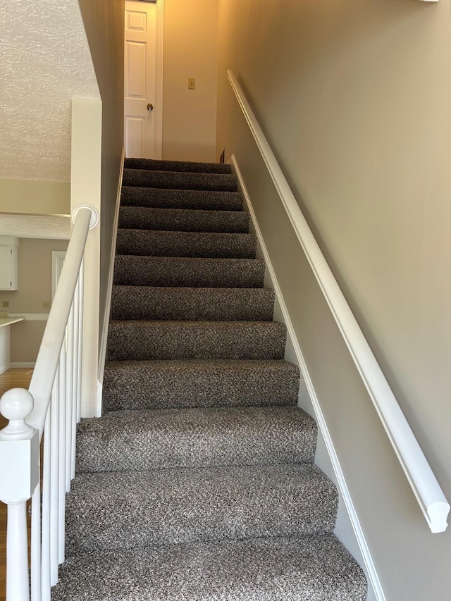 1555 Bodwell Rd Unit 59, Manchester, NH 03109 - stairs with a textured ceiling