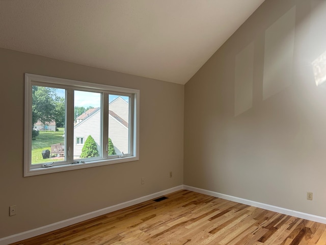 1555 Bodwell Rd Unit 59, Manchester, NH 03109 - unfurnished room with light wood-type flooring and vaulted ceiling