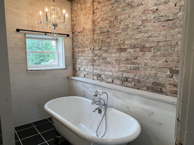 249 Ward Rd, Poultney, VT 05764 - bathroom featuring a freestanding bath, tile patterned floors, and a chandelier
