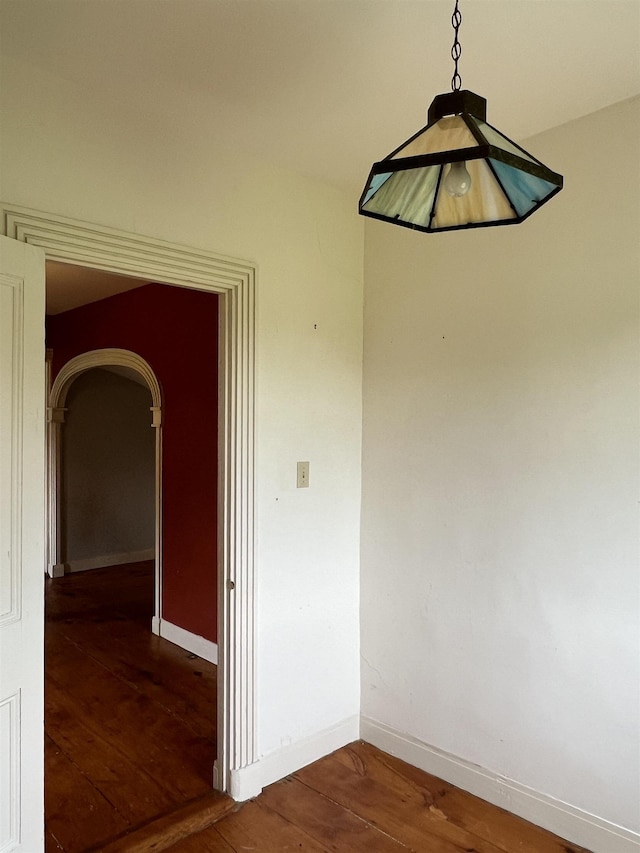 249 Ward Rd, Poultney, VT 05764 - empty room with hardwood / wood-style flooring and arched walkways