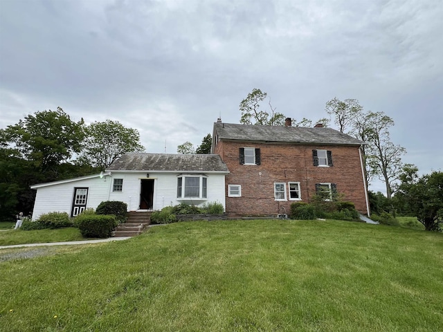 249 Ward Rd, Poultney, VT 05764 - view of front of house featuring a chimney and a front lawn
