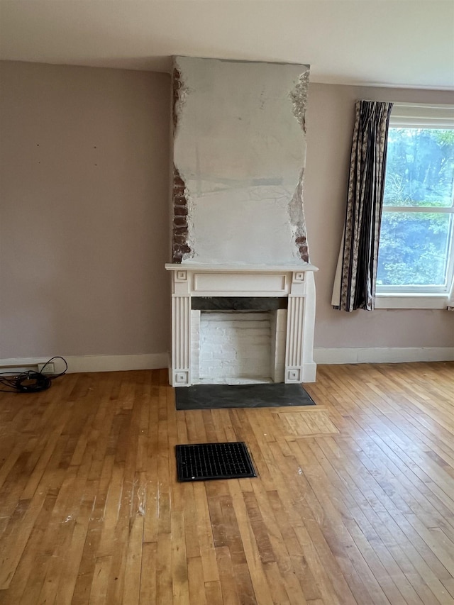 249 Ward Rd, Poultney, VT 05764 - detailed view of wood finished floors and a fireplace with flush hearth