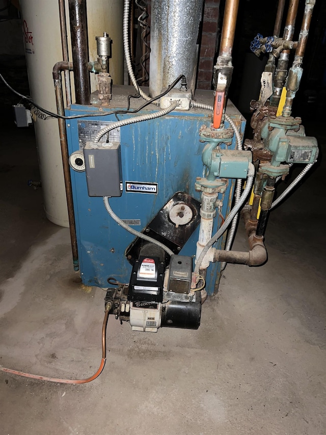 249 Ward Rd, Poultney, VT 05764 - utility room with a heating unit and gas water heater