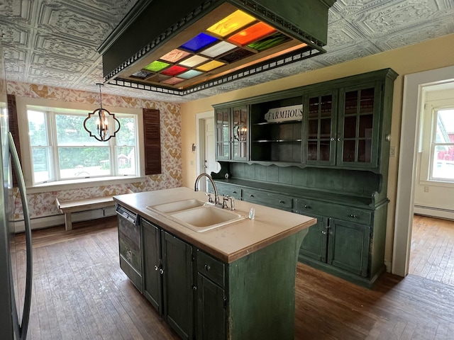 249 Ward Rd, Poultney, VT 05764 - kitchen featuring dark wood finished floors, a center island with sink, wallpapered walls, a chandelier, and an ornate ceiling