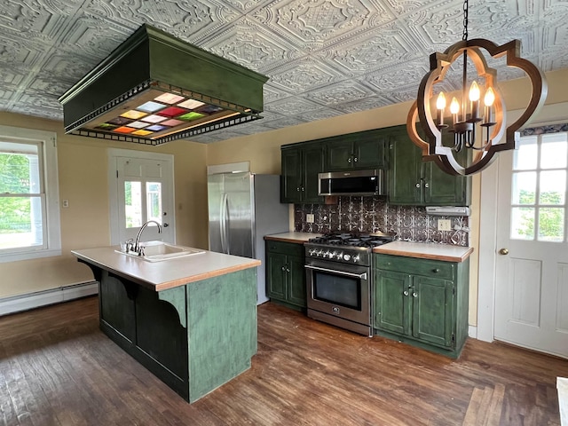 249 Ward Rd, Poultney, VT 05764 - kitchen with appliances with stainless steel finishes, green cabinets, an ornate ceiling, light countertops, and a baseboard radiator