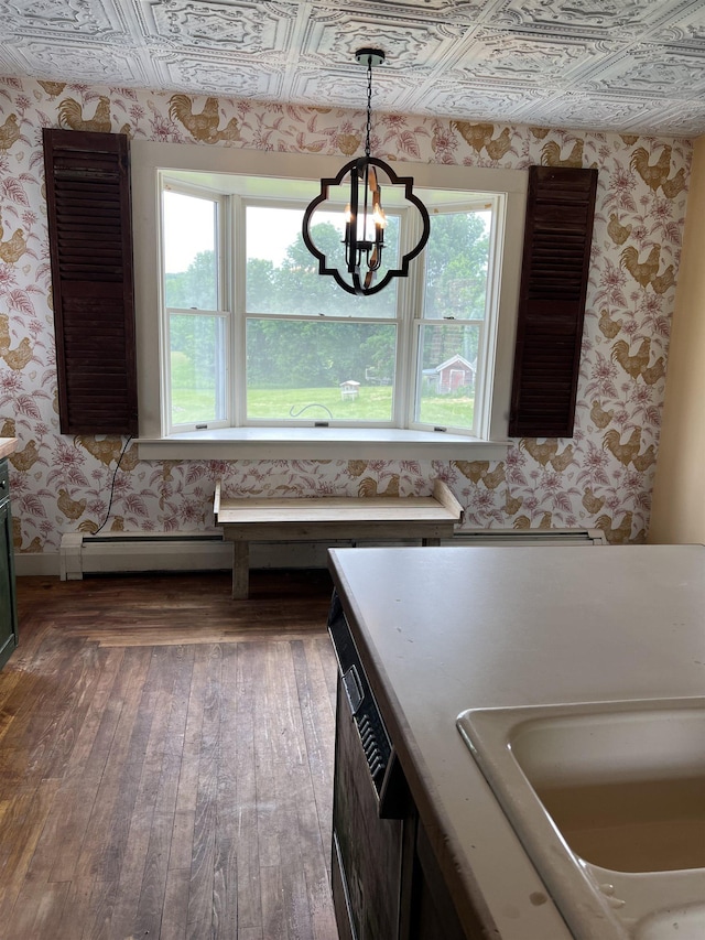 249 Ward Rd, Poultney, VT 05764 - kitchen with wallpapered walls, healthy amount of natural light, hardwood / wood-style flooring, a chandelier, and pendant lighting